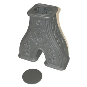 Dovre 100/120 CBS etasjestykke i sort støpejern med dekorative relieffer og rund åpning på toppen for røykpipe eller kokeplate.